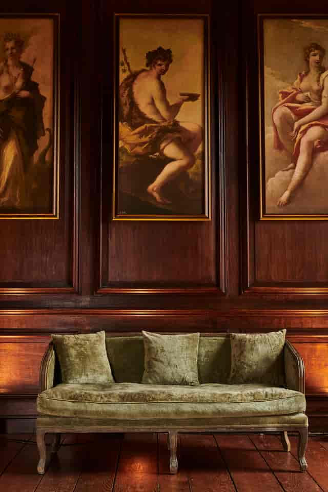 Little Banqueting House at Hampton Court Palace, elegant meeting space with rich wood paneling.