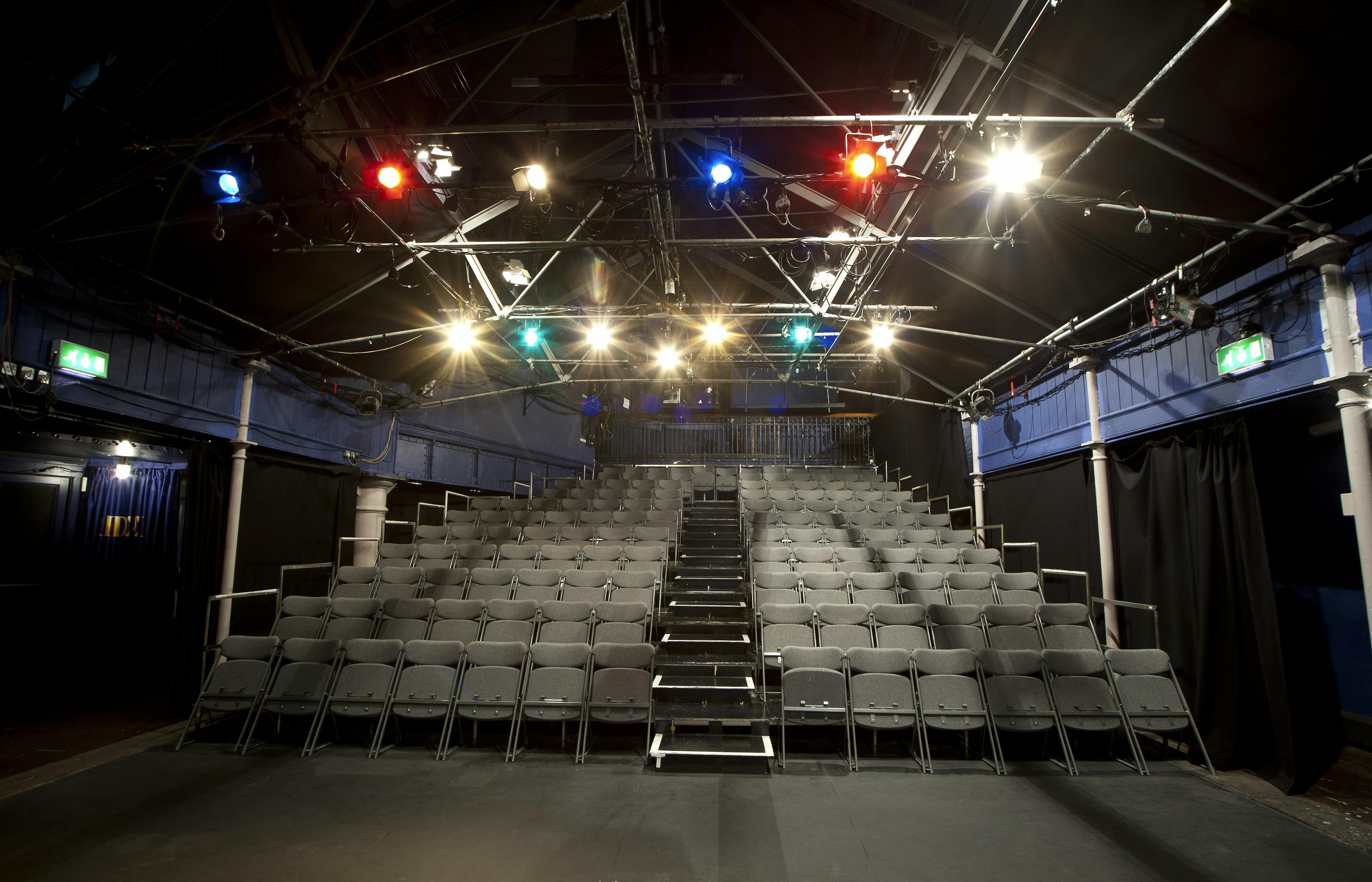 Bridewell Theatre event space with tiered seating, ideal for conferences and performances.