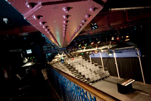 Bridewell Theatre event space with tiered seating, ideal for presentations and performances.