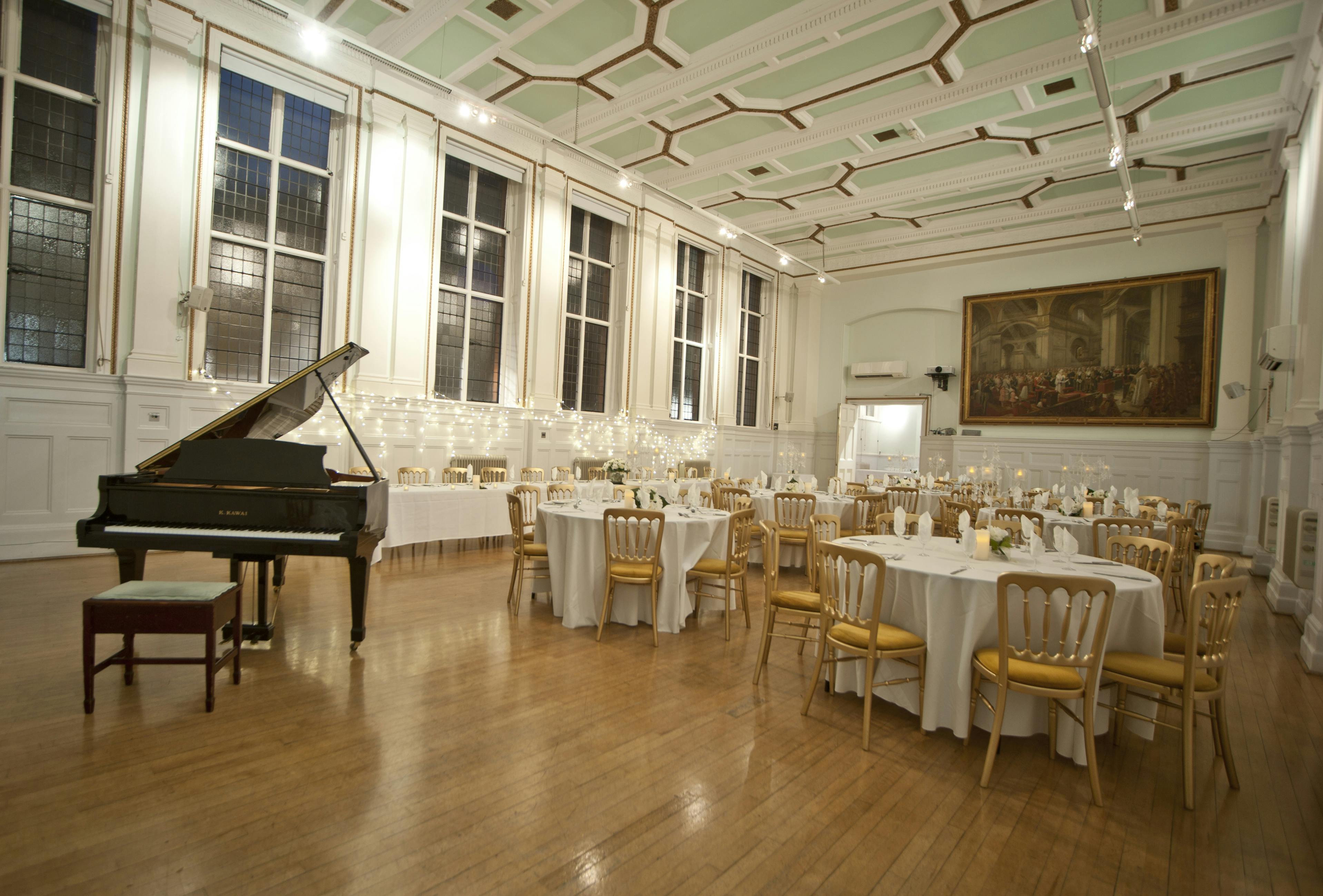 Elegant Bridewell Hall event space with grand piano, ideal for receptions and corporate events.