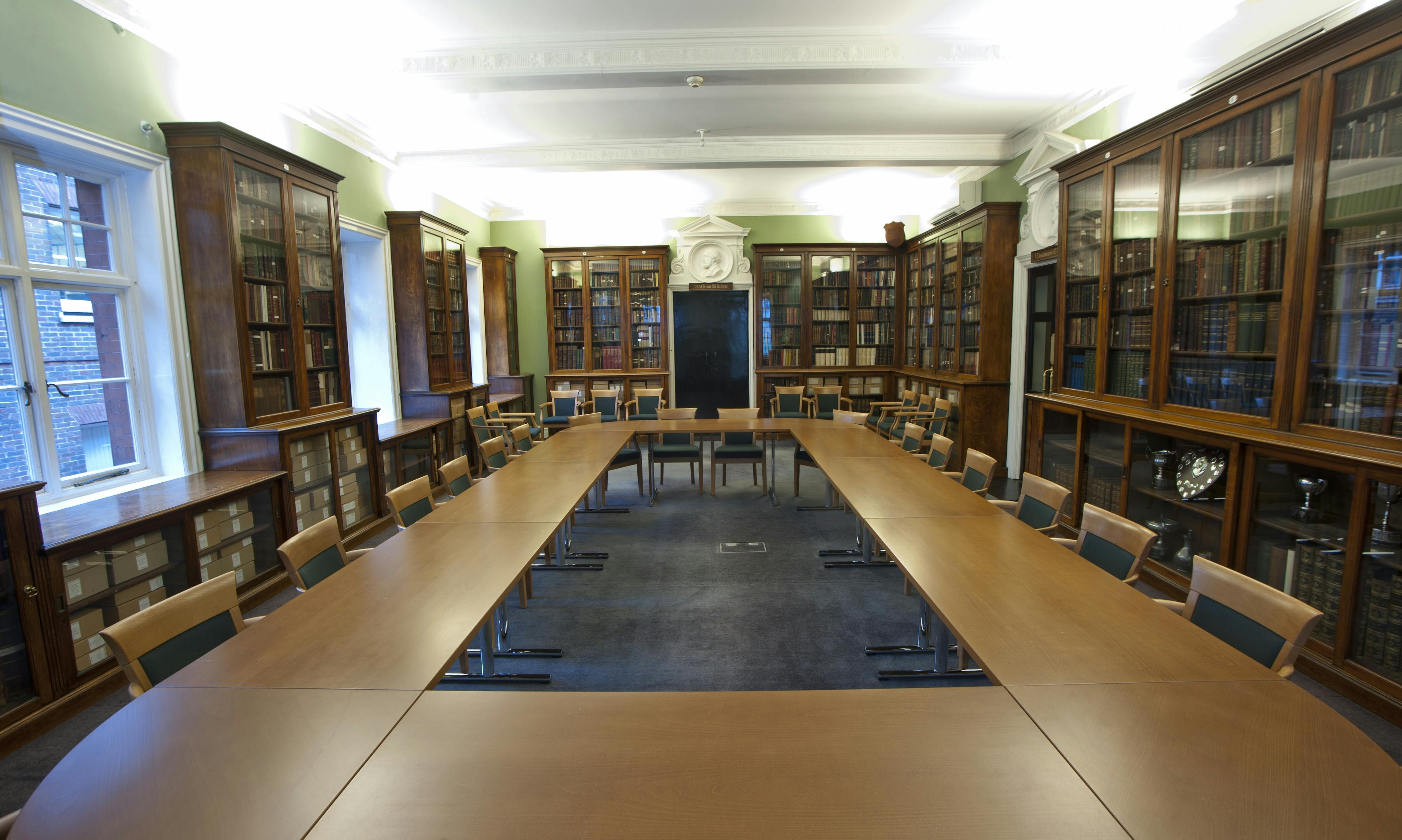 Passmore Edwards Room: spacious meeting venue with elegant bookshelves for conferences.