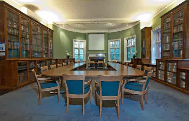 Passmore Edwards Room: elegant meeting space with oval table, ideal for workshops and presentations.