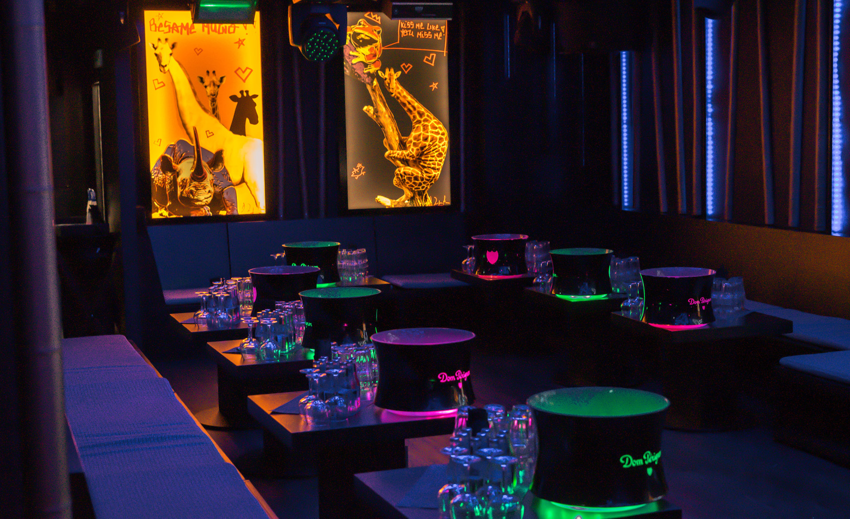 Vibrant nightlife event space at Sumosan Twiga with illuminated tables for parties.