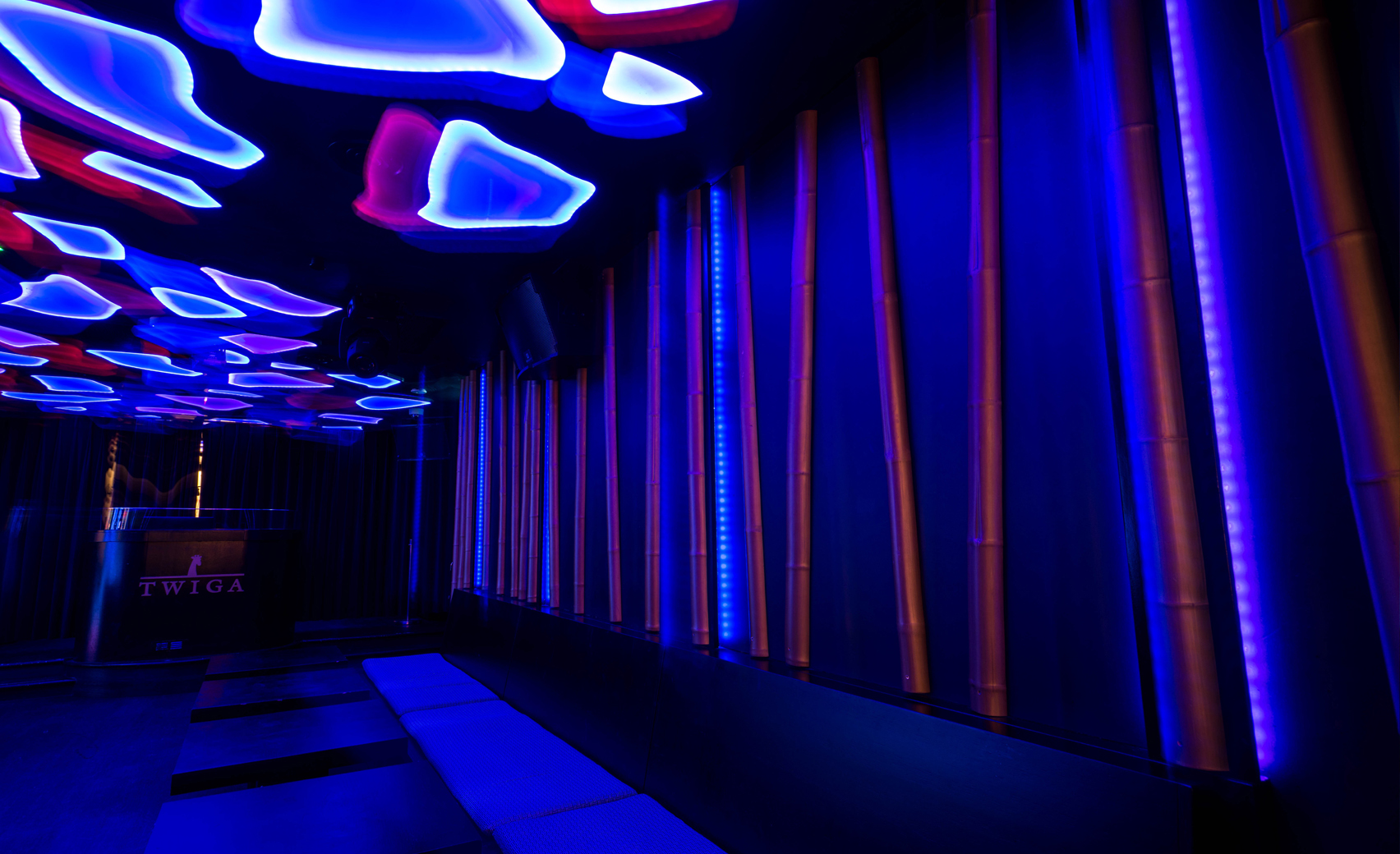 Modern event space at Sumosan Twiga with colorful lighting for networking and gatherings.