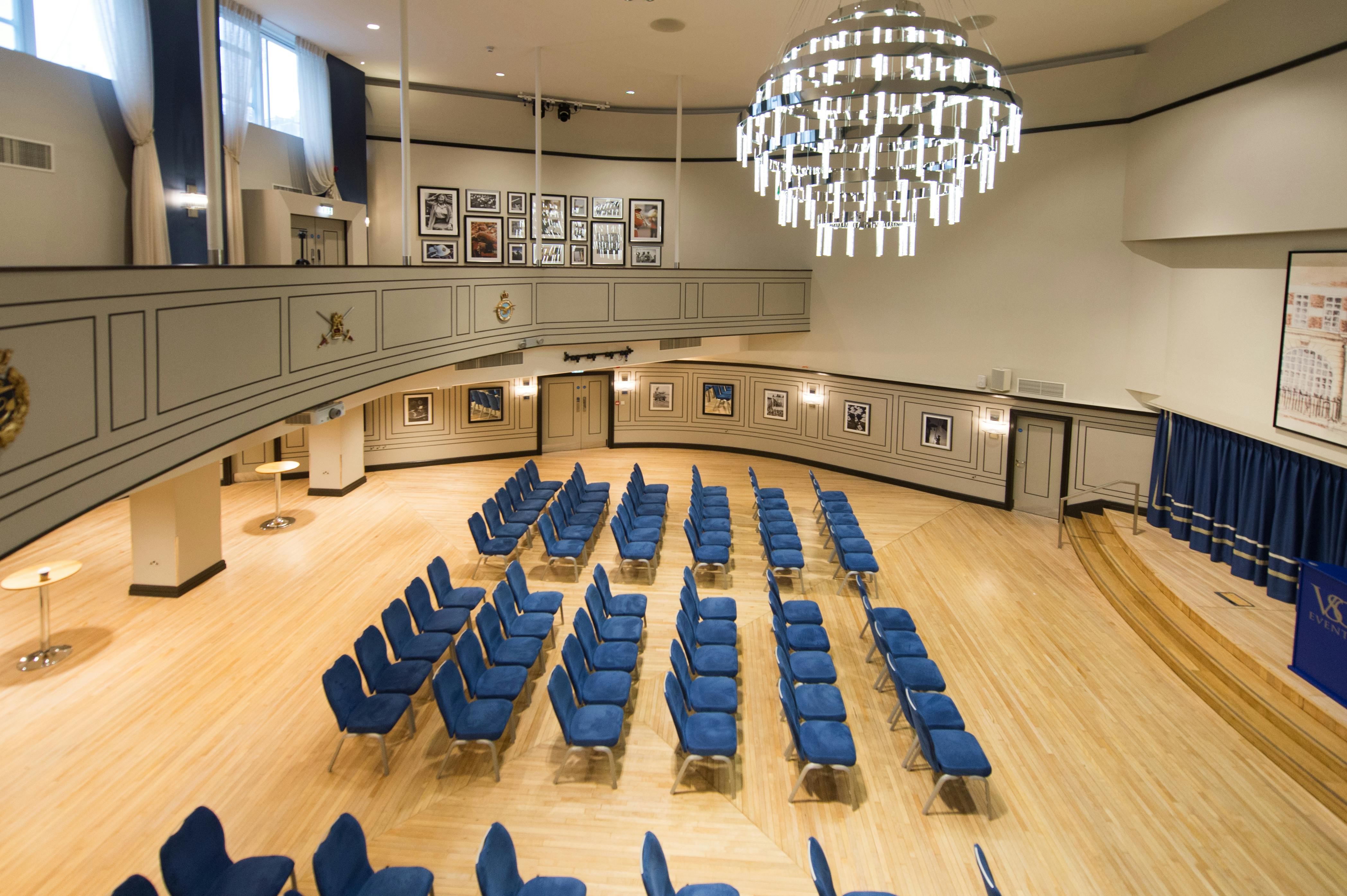 Carisbrooke Hall with blue chairs, ideal for conferences and workshops.