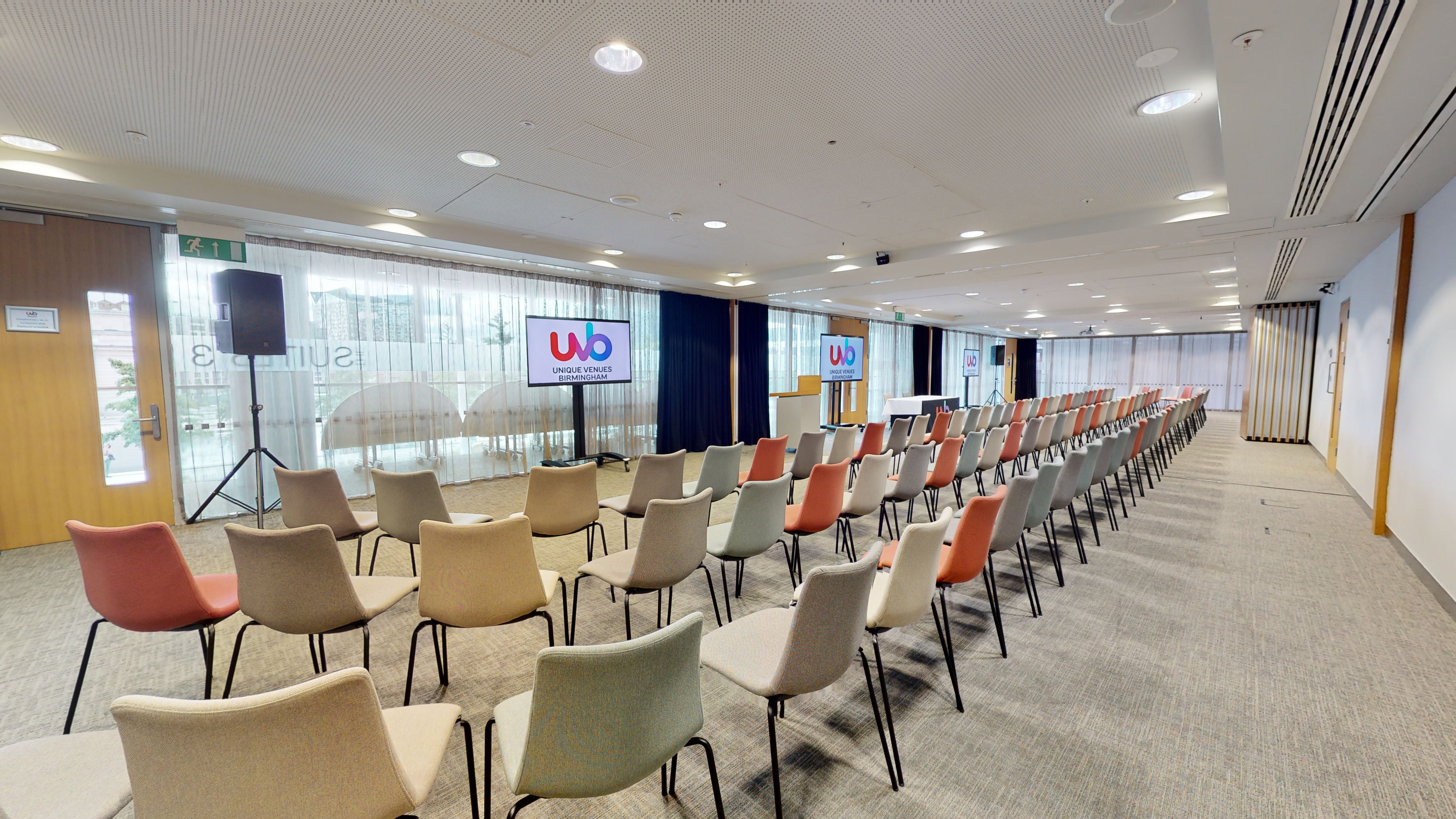 Event space at Unique Venues Birmingham with dual screens for presentations.