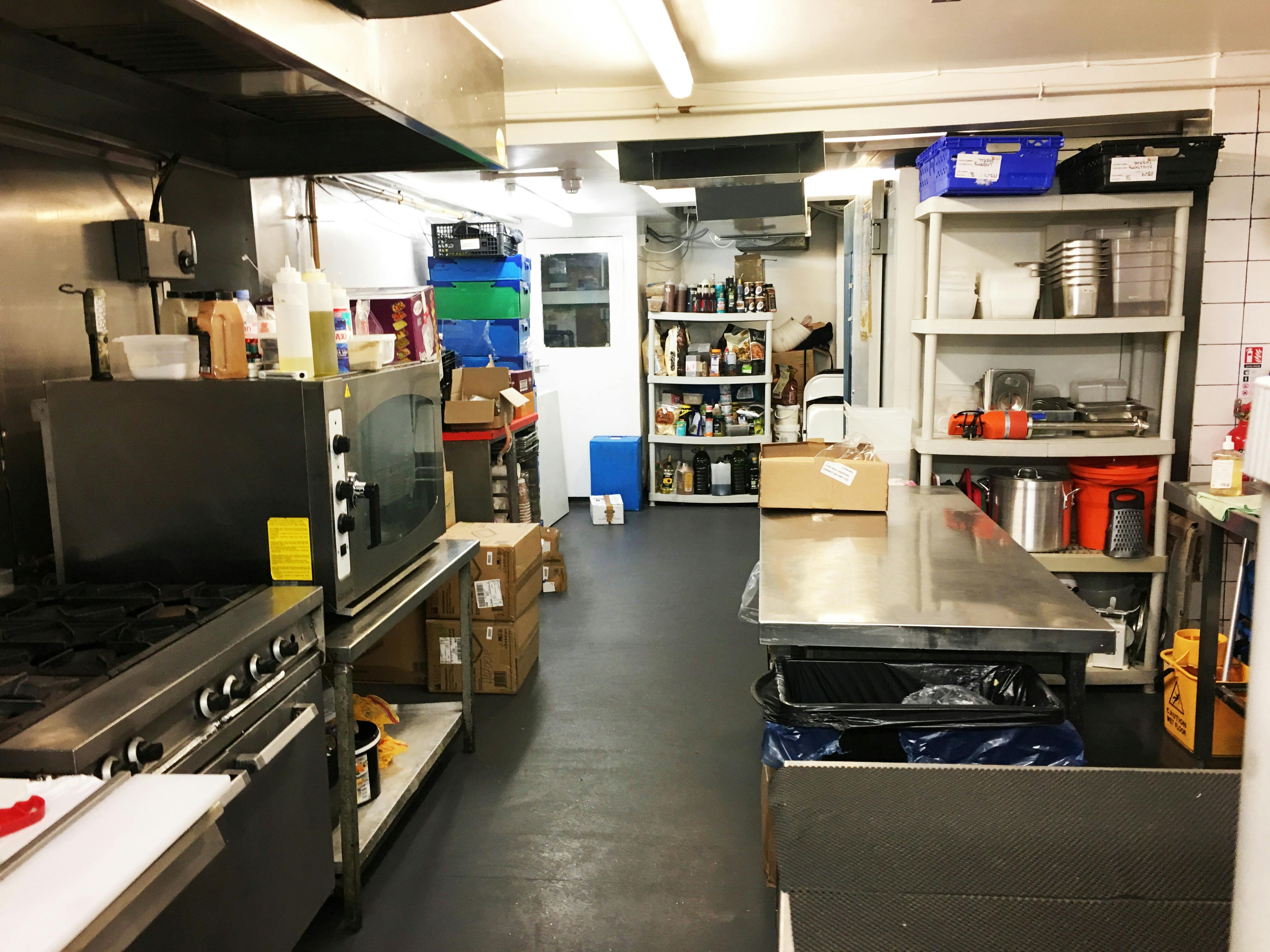 Commercial kitchen in Chelsea Creperie, stainless steel setup for catering events.