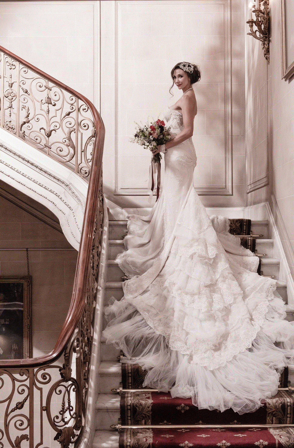 Elegant bride on staircase at No. 4 Hamilton Place, perfect for romantic weddings. - Banner