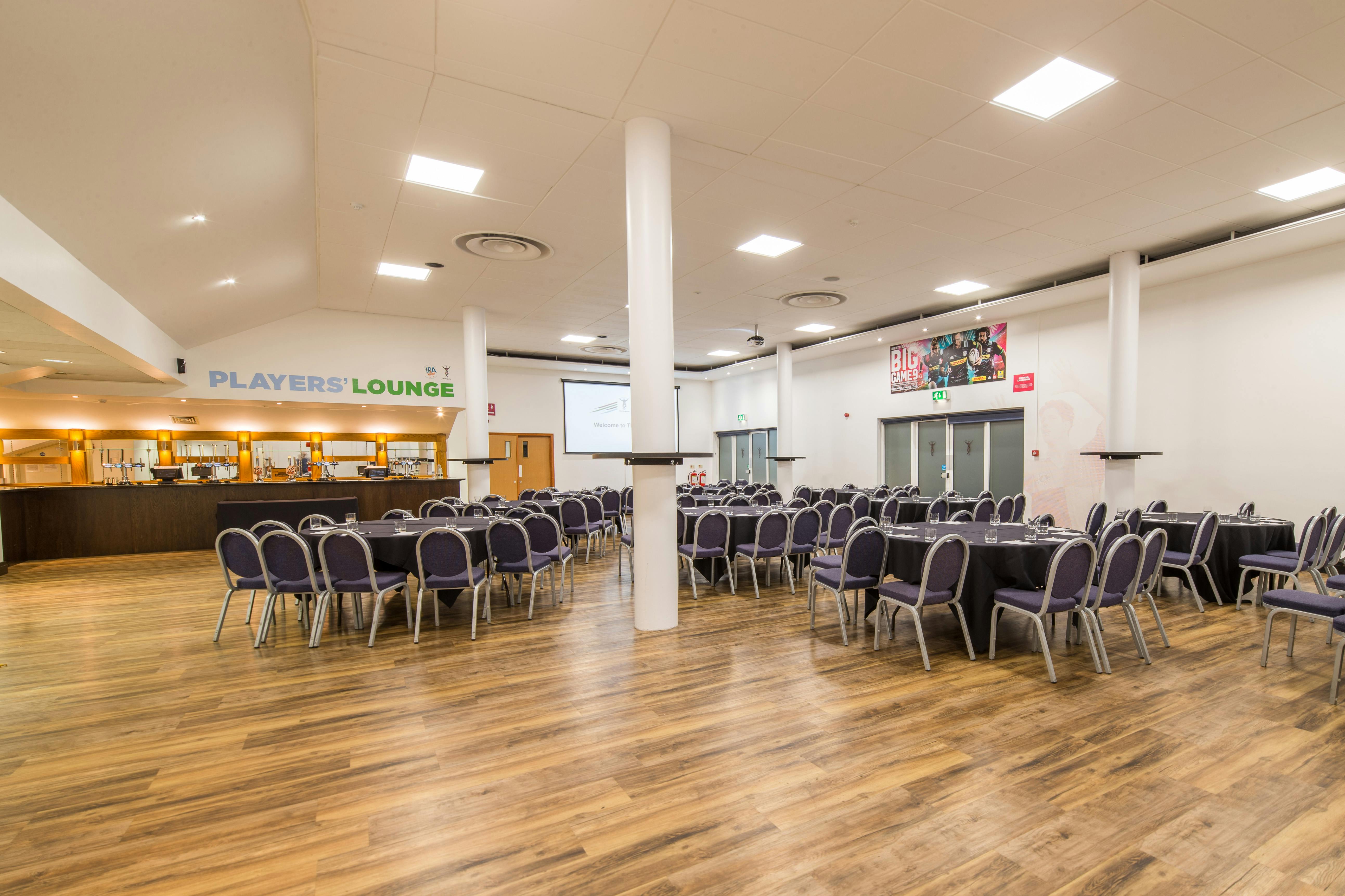 Twickenham Stoop Stadium event space with round tables, ideal for meetings and banquets.