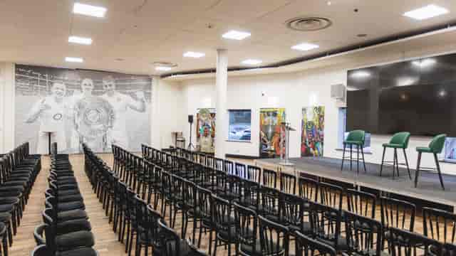 Chris Robshaw Bar event space with stage, chairs, and sports-themed decor for corporate meetings.