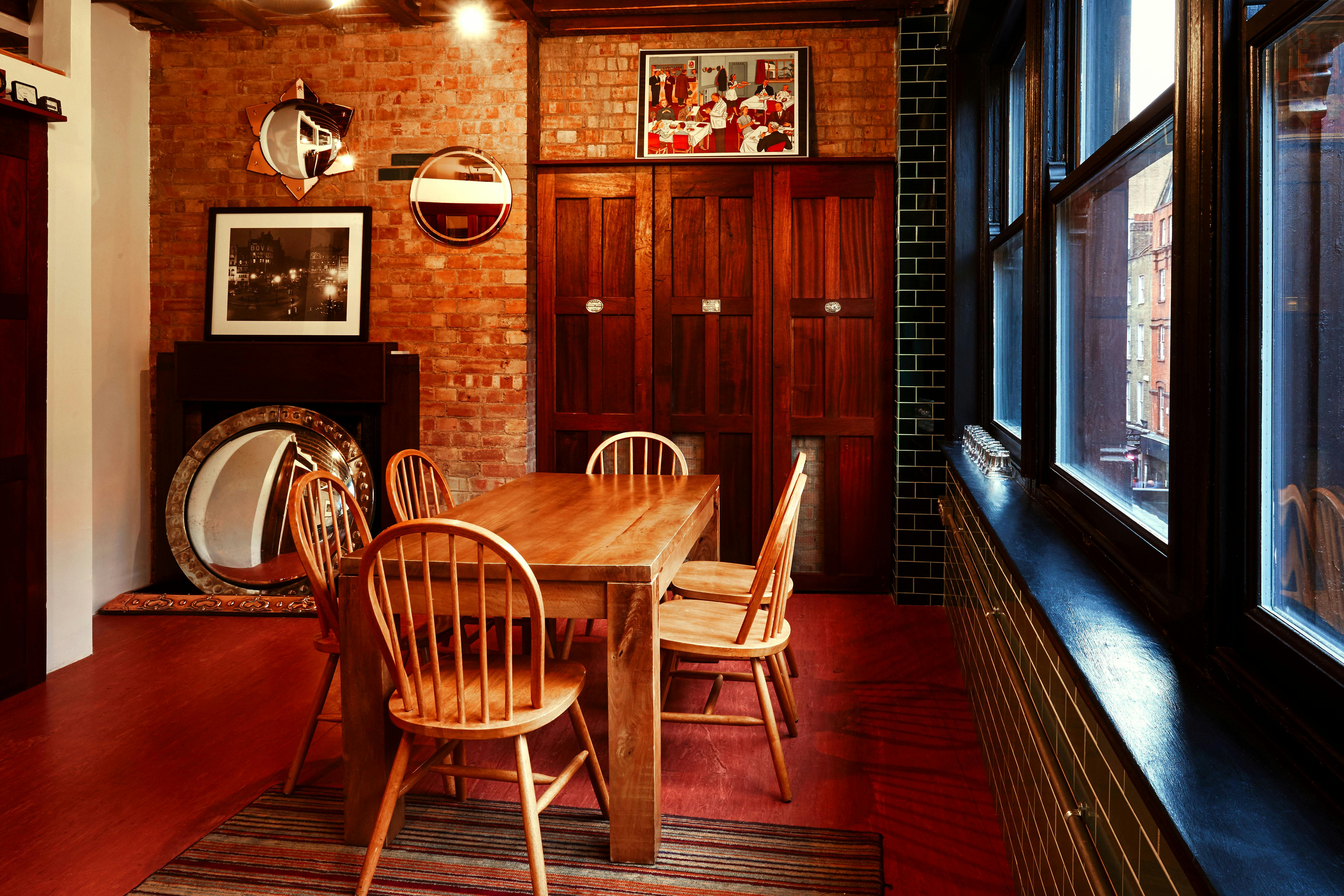 Cozy Writers Room at The Union Club with wooden table, ideal for meetings and brainstorming.