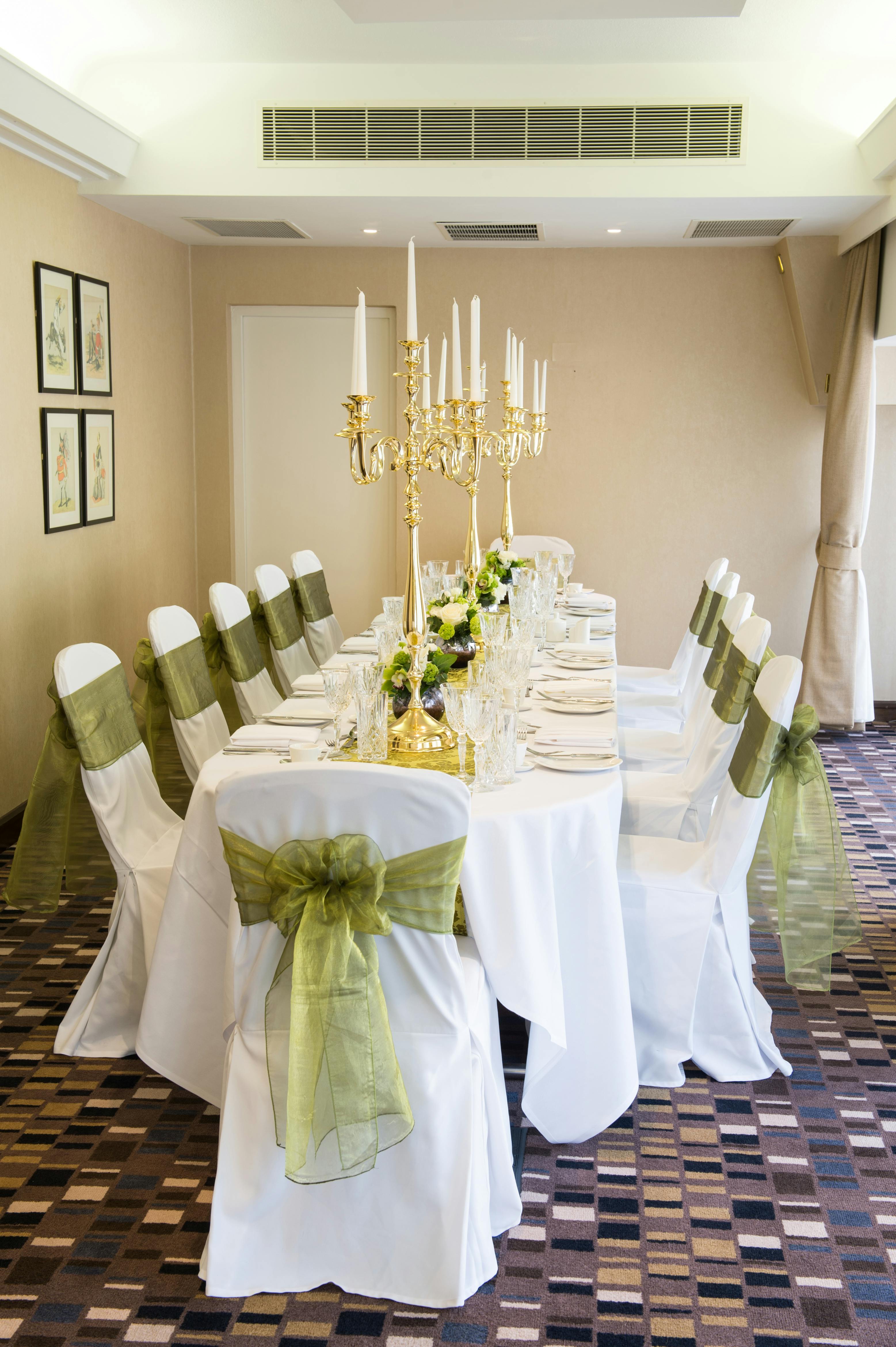 Elegant banquet table with gold candelabra at Chetwode Room, perfect for weddings and corporate events.