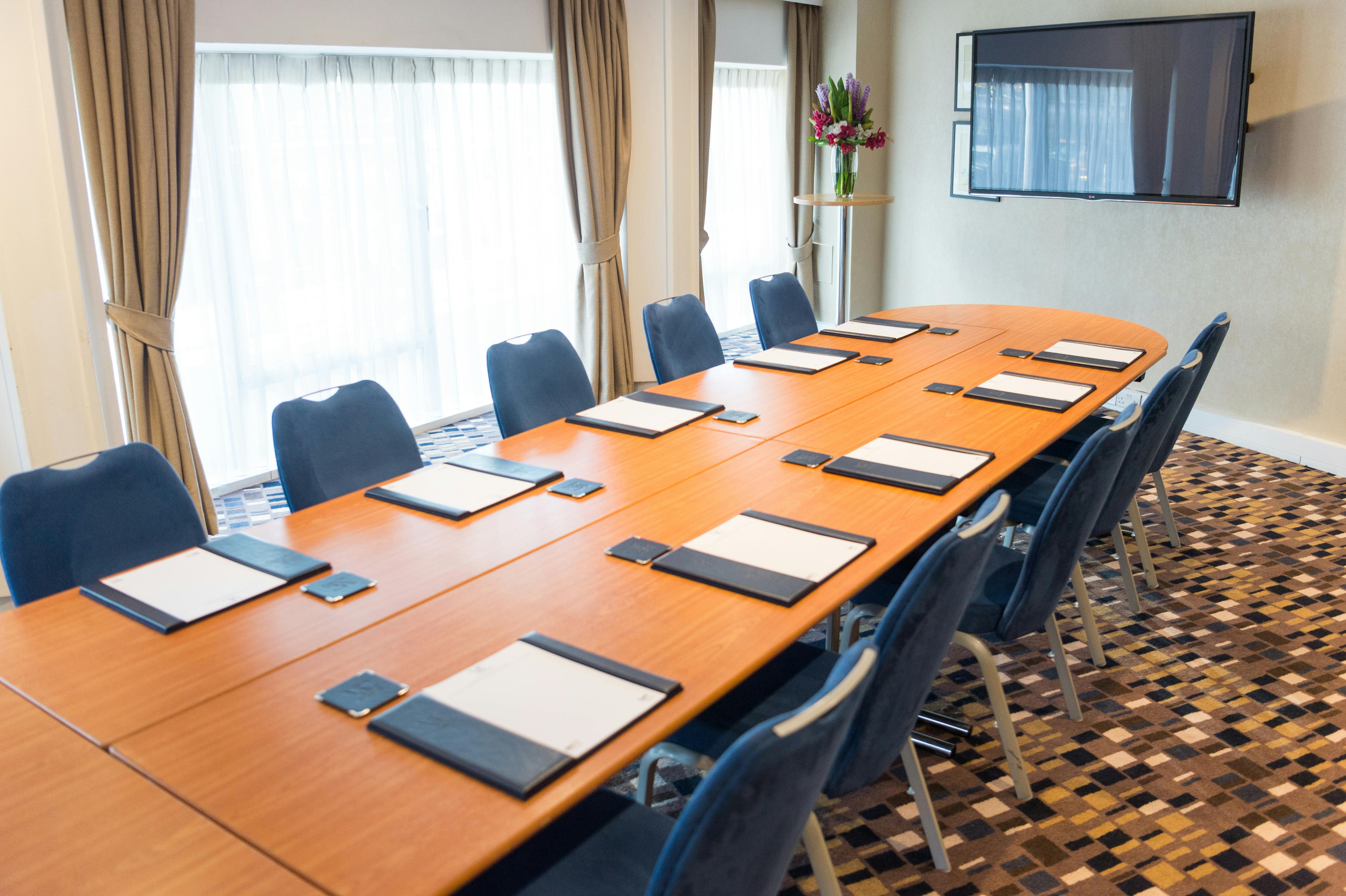 Allenby Room at Victory Services Club, polished table ready for professional meetings.