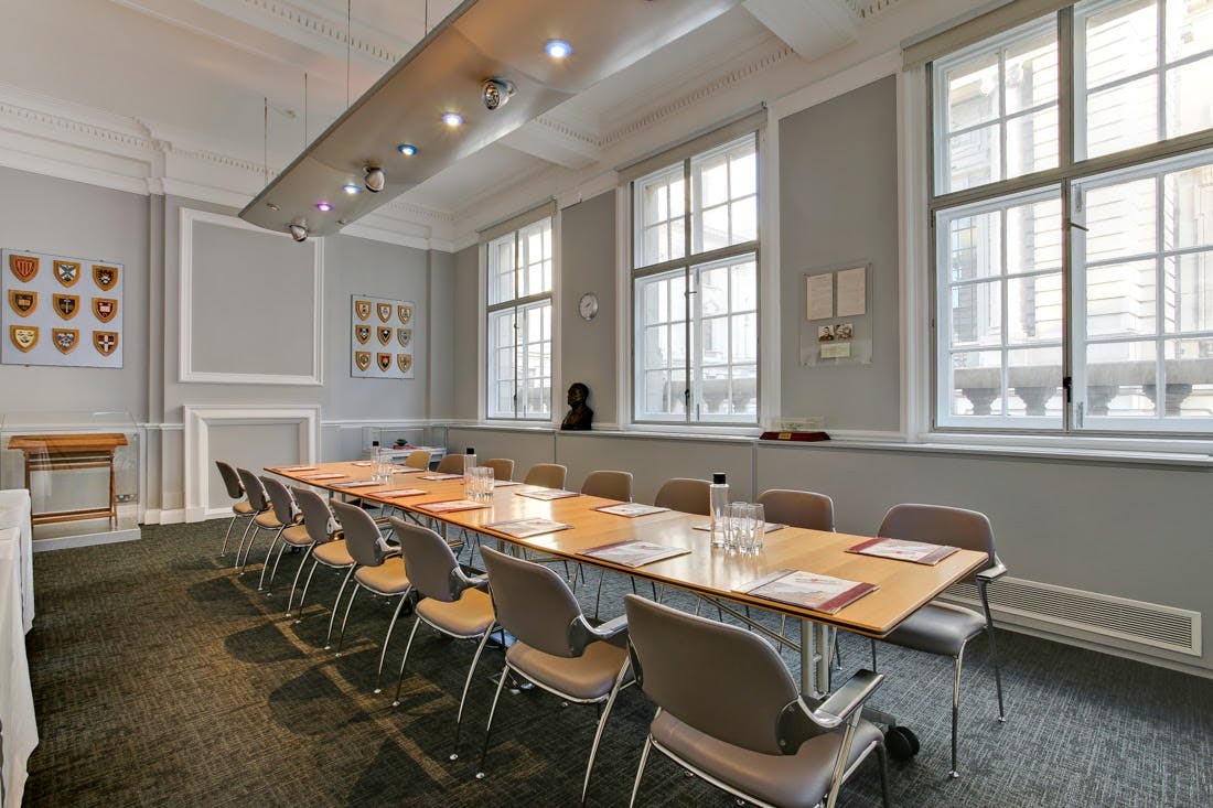 Frank Whittle in a bright, minimalist meeting room for professional events.