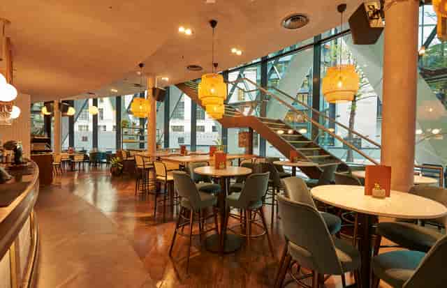 Modern Main Bar at The Sterling, ideal for meetings and events with natural light.