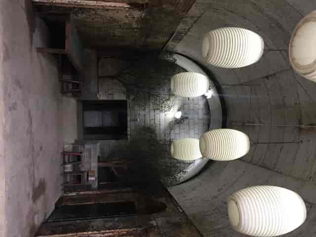 TESTBED1 event space with arched corridor, ideal for workshops and gatherings.