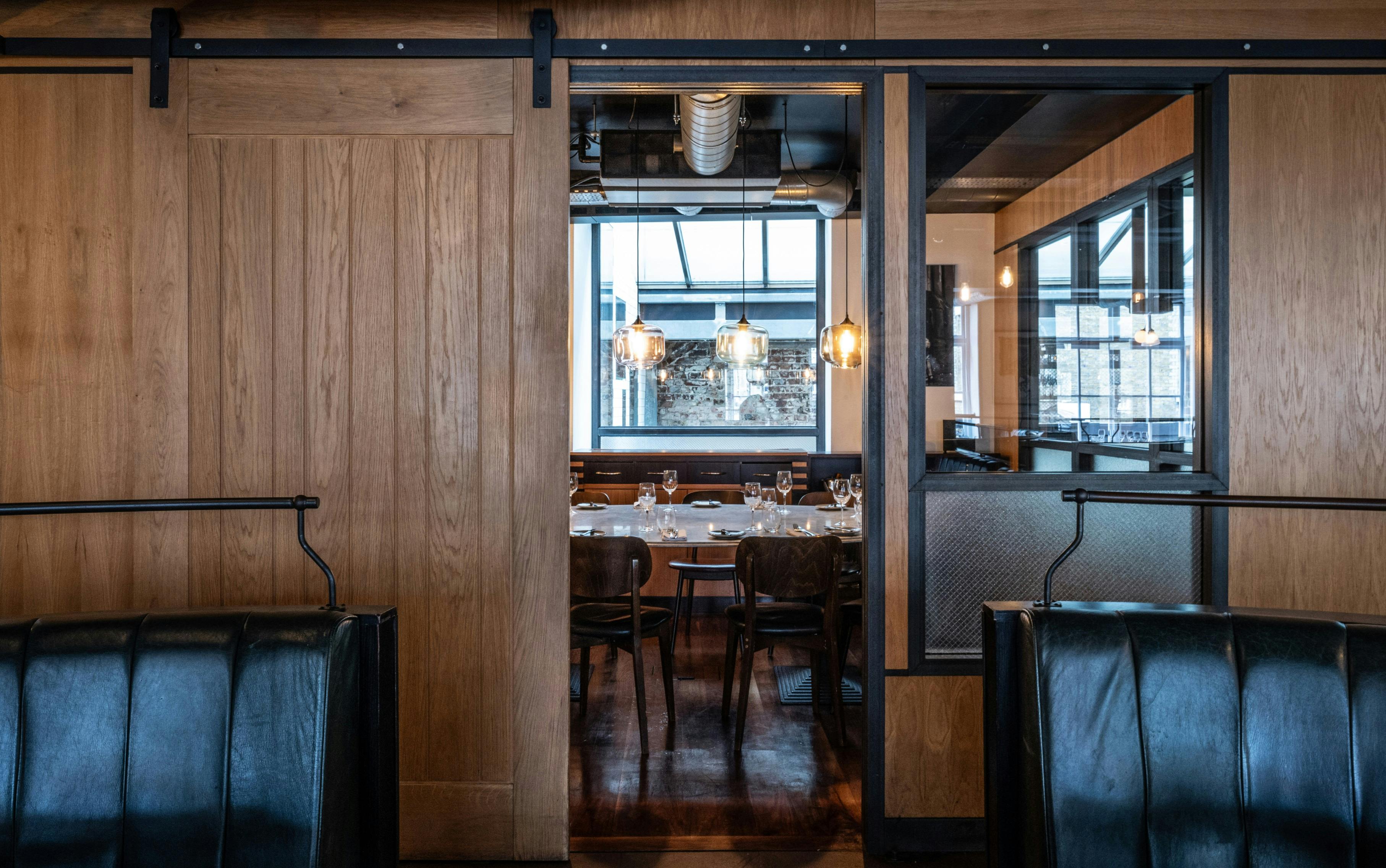 Private dining room at Heddon Street Kitchen, modern decor for events and gatherings.