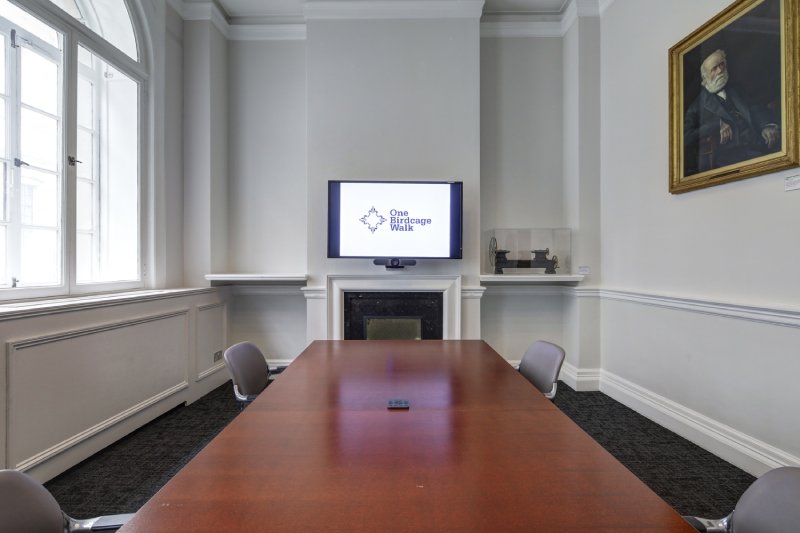 Joseph Whitworth meeting room with wooden table, ideal for presentations and discussions. - Banner