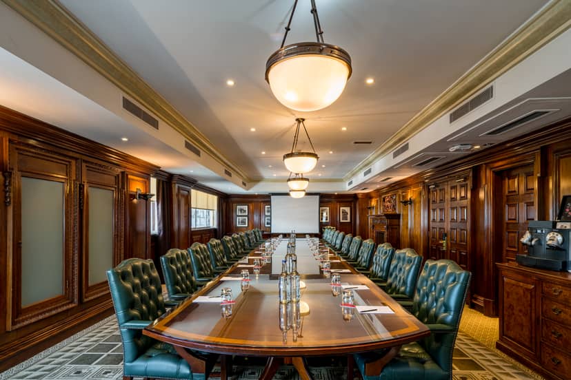 Sophisticated boardroom at Speakers' Corner, polished table, ideal for meetings and presentations.