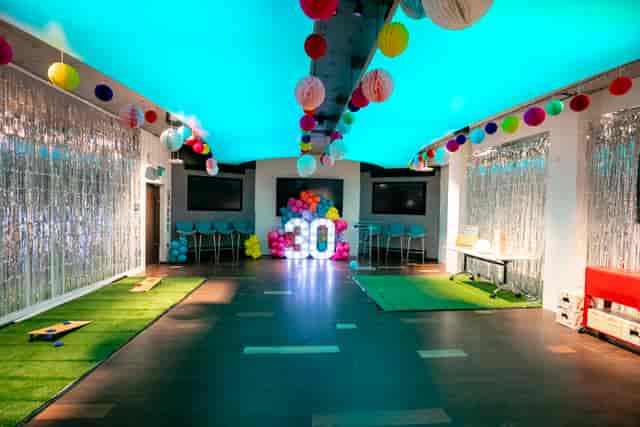 Vibrant event space at IDEALondon for milestone birthday celebrations with colorful decor.