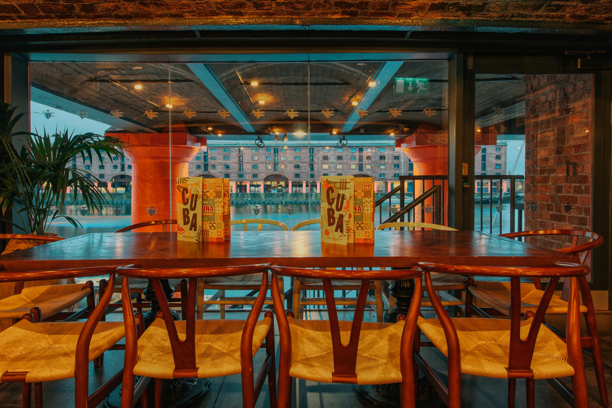 Stylish meeting space with wooden table and scenic views, perfect for networking events.