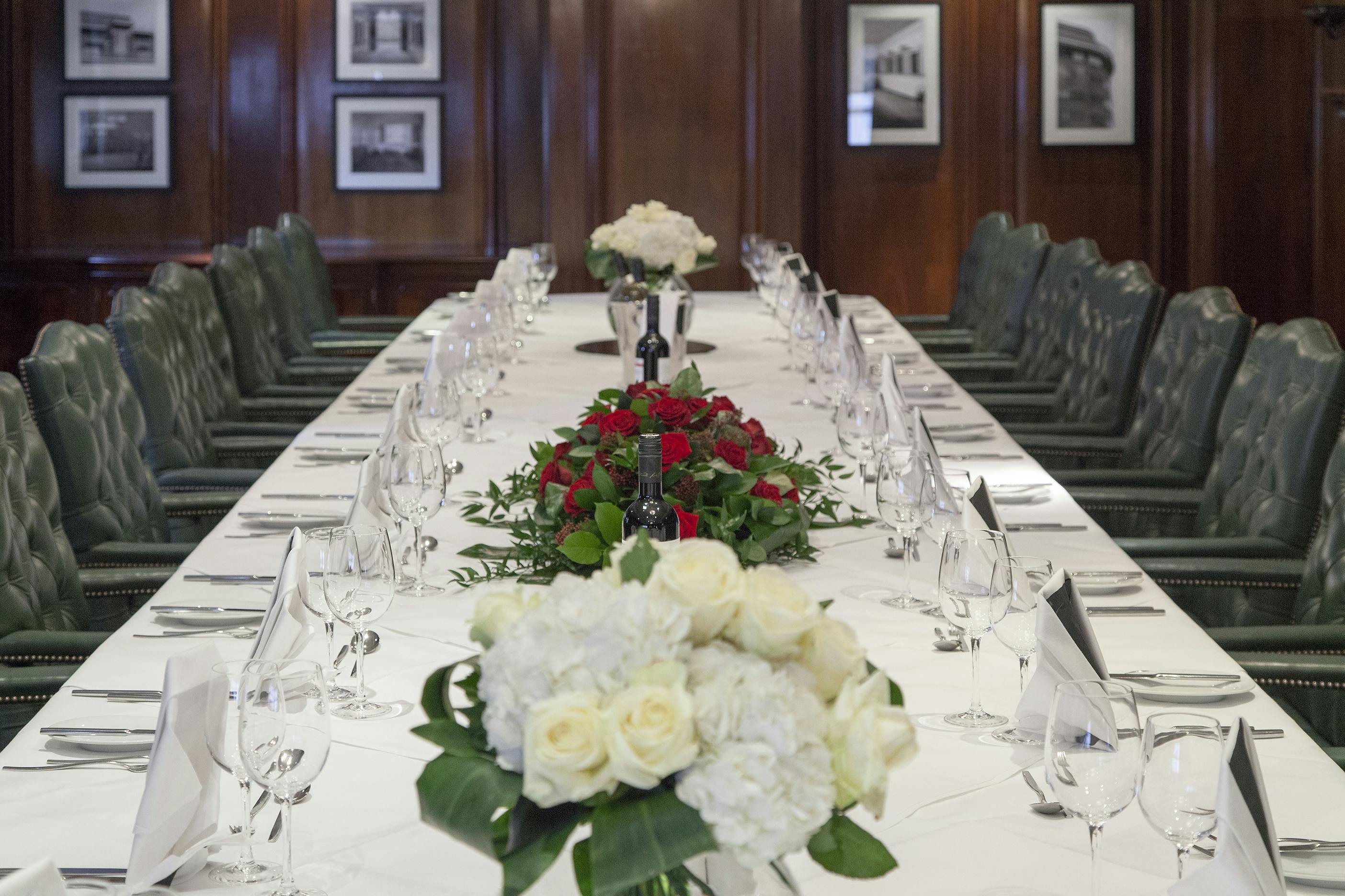 Elegant banquet table with floral centerpieces at Thistle Marble Arch for corporate events.