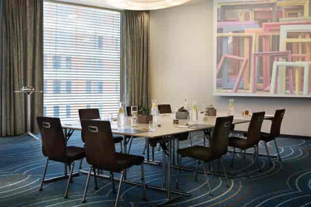 Meeting room at Renaissance Zurich Tower, featuring a large table for productive workshops.