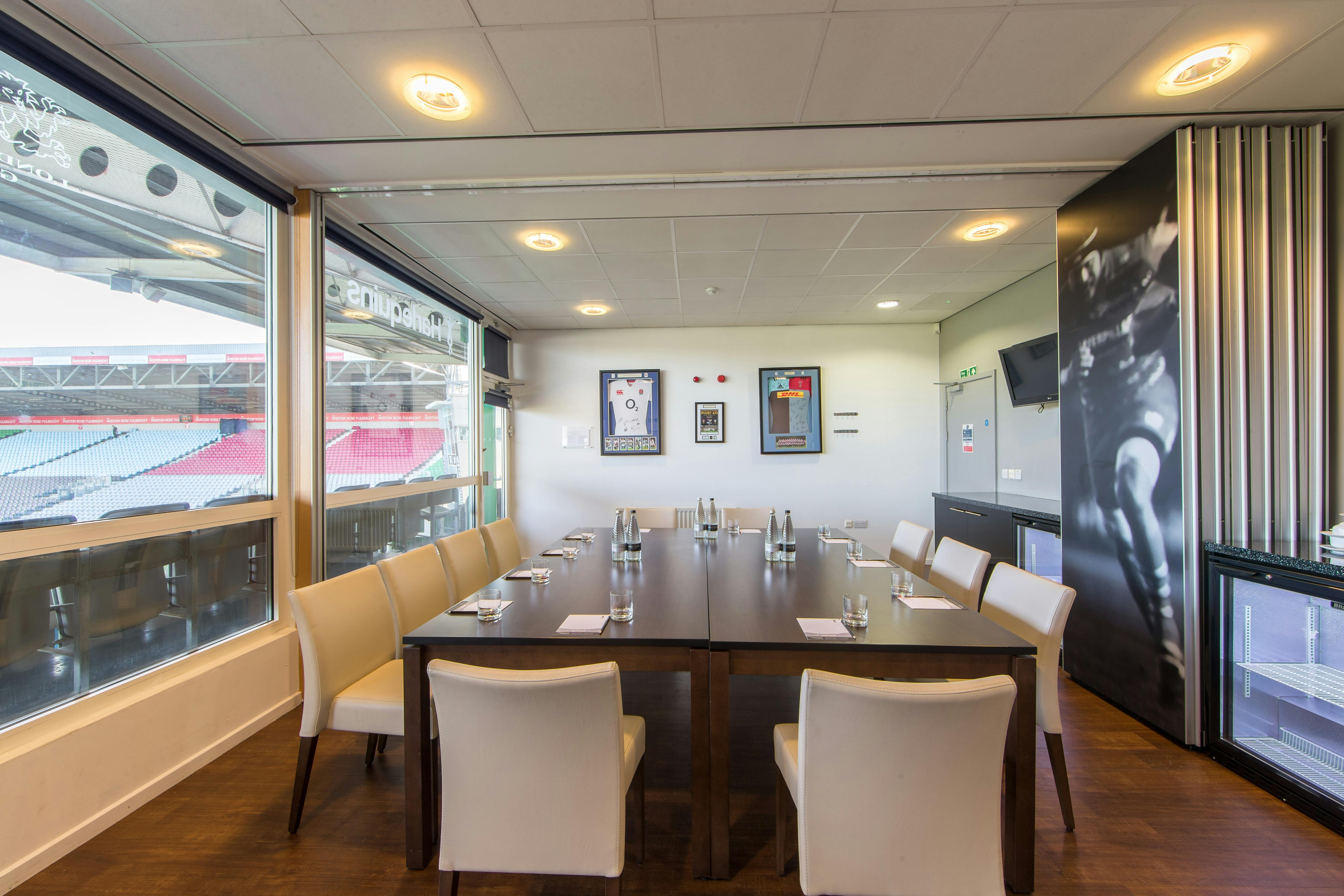 Double Executive Boxes at Twickenham Stoop Stadium, modern meeting room with stadium views.