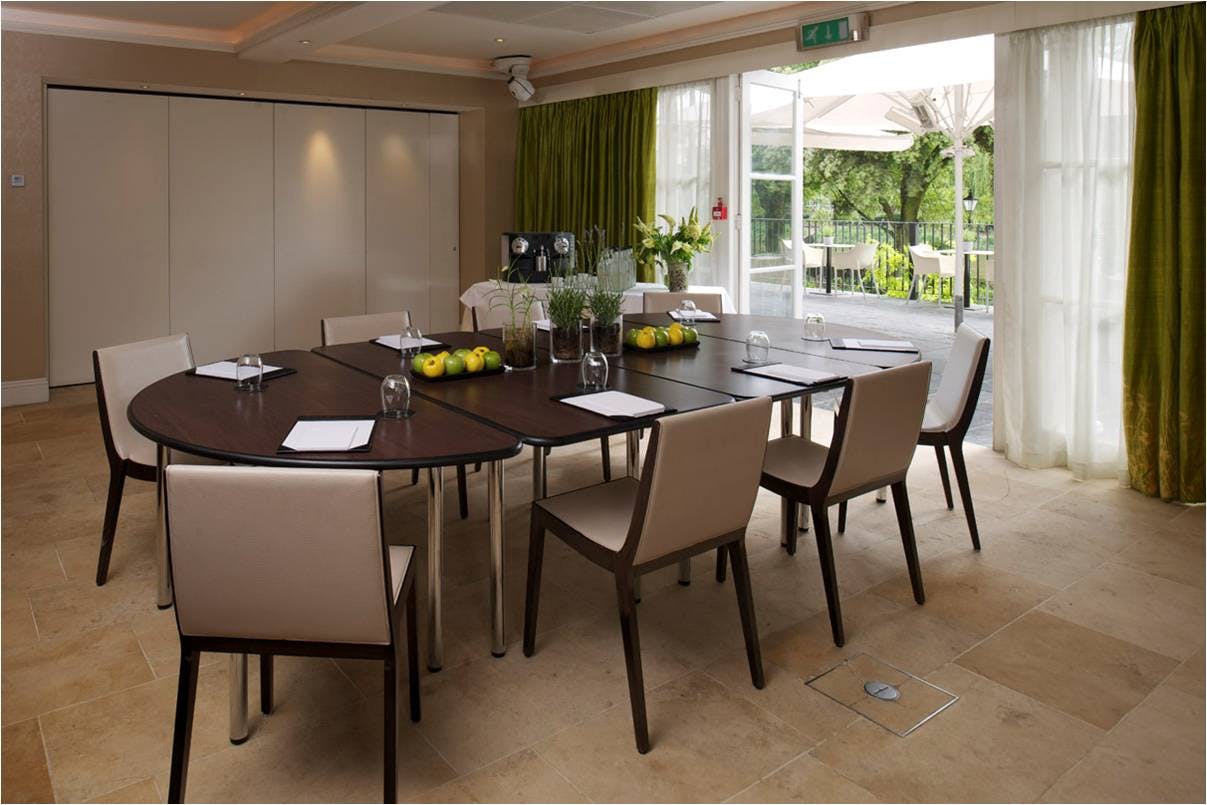 Garden Room 3 at The Bingham: oval table, natural light, perfect for meetings and workshops.