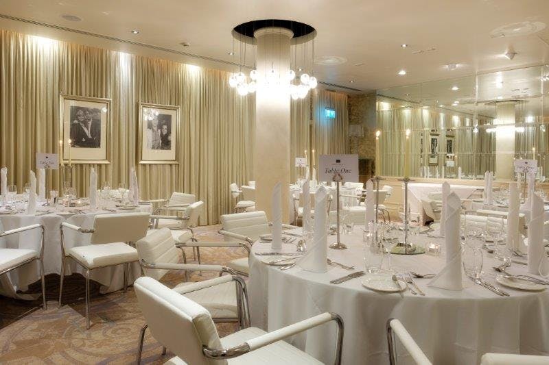 Elegant dinner setup in Hard Days Night Hotel for corporate events and upscale gatherings.