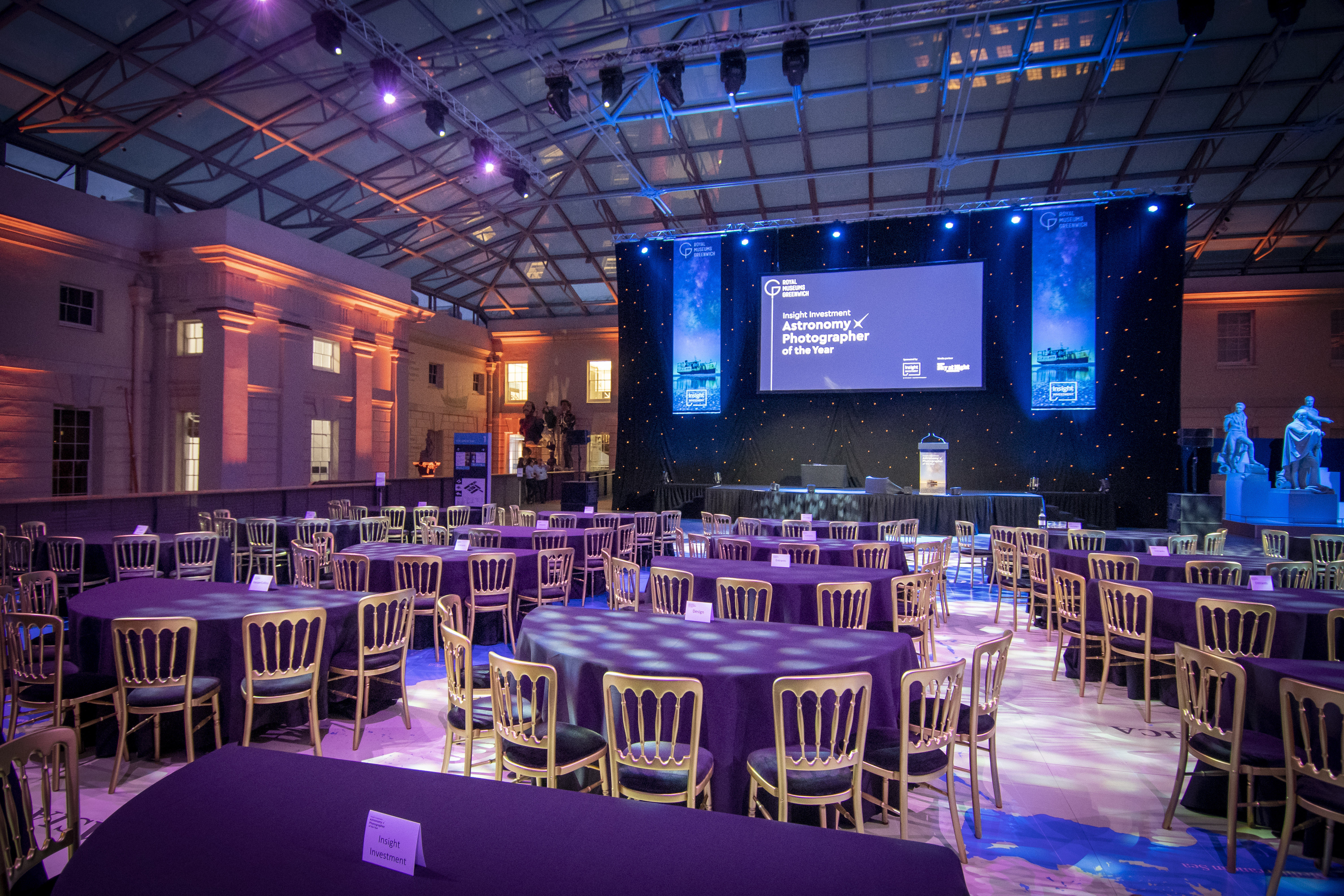 Elegant event setup with round tables at National Maritime Museum for gala or corporate events. - Banner