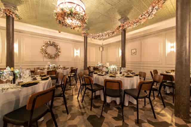 Elegant dining space with round tables, perfect for upscale banquets or corporate events