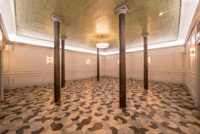 Elegant event space with patterned floor, ideal for corporate functions and upscale gatherings.