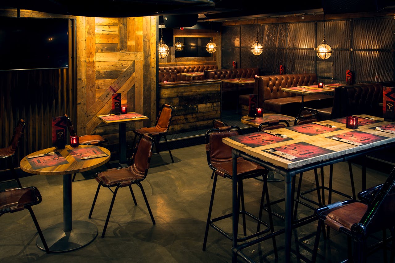 Stylish rustic restaurant venue with cozy seating for intimate gatherings in Dive NQ.