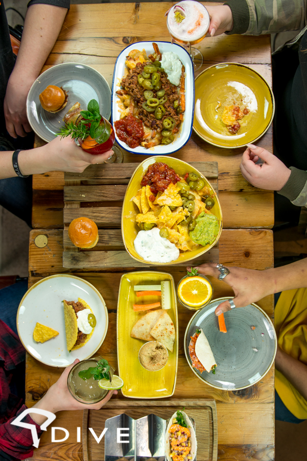 Vibrant food spread at Dive NQ for casual networking and team-building events.