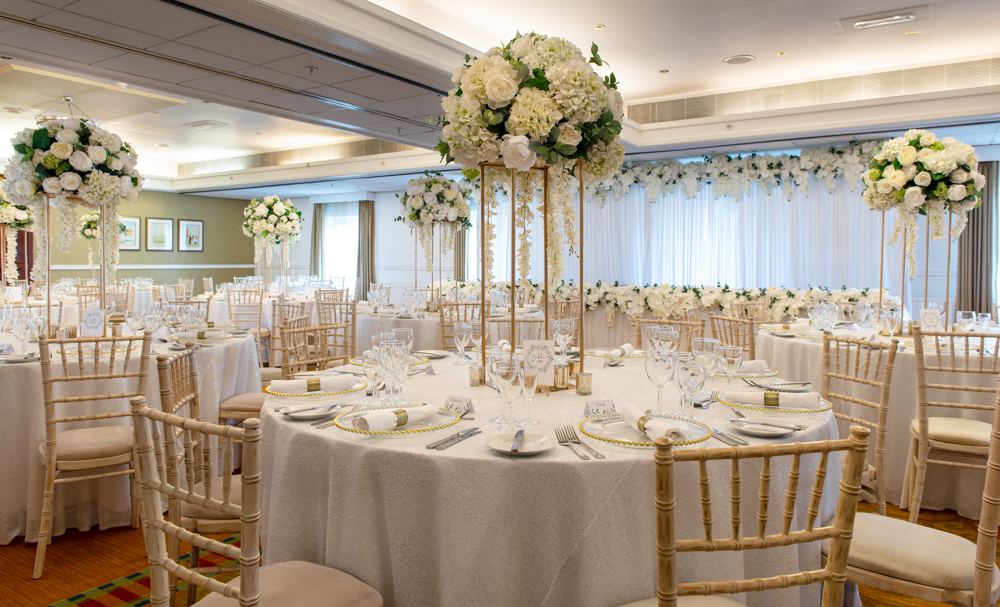 Elegant banquet hall with floral centerpieces for weddings and corporate events. - Banner