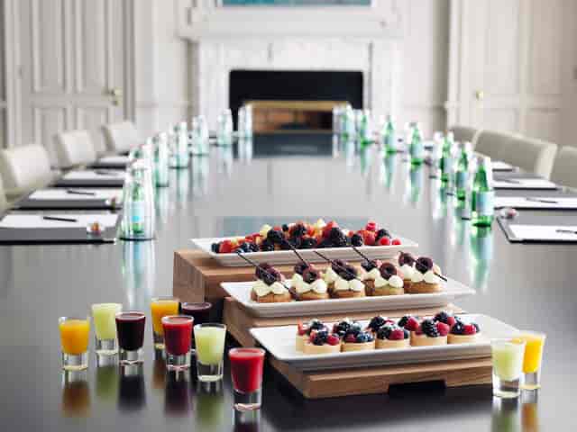 Trinity Suite meeting room at The Westbury Hotel, Dublin with gourmet desserts and shot glasses.