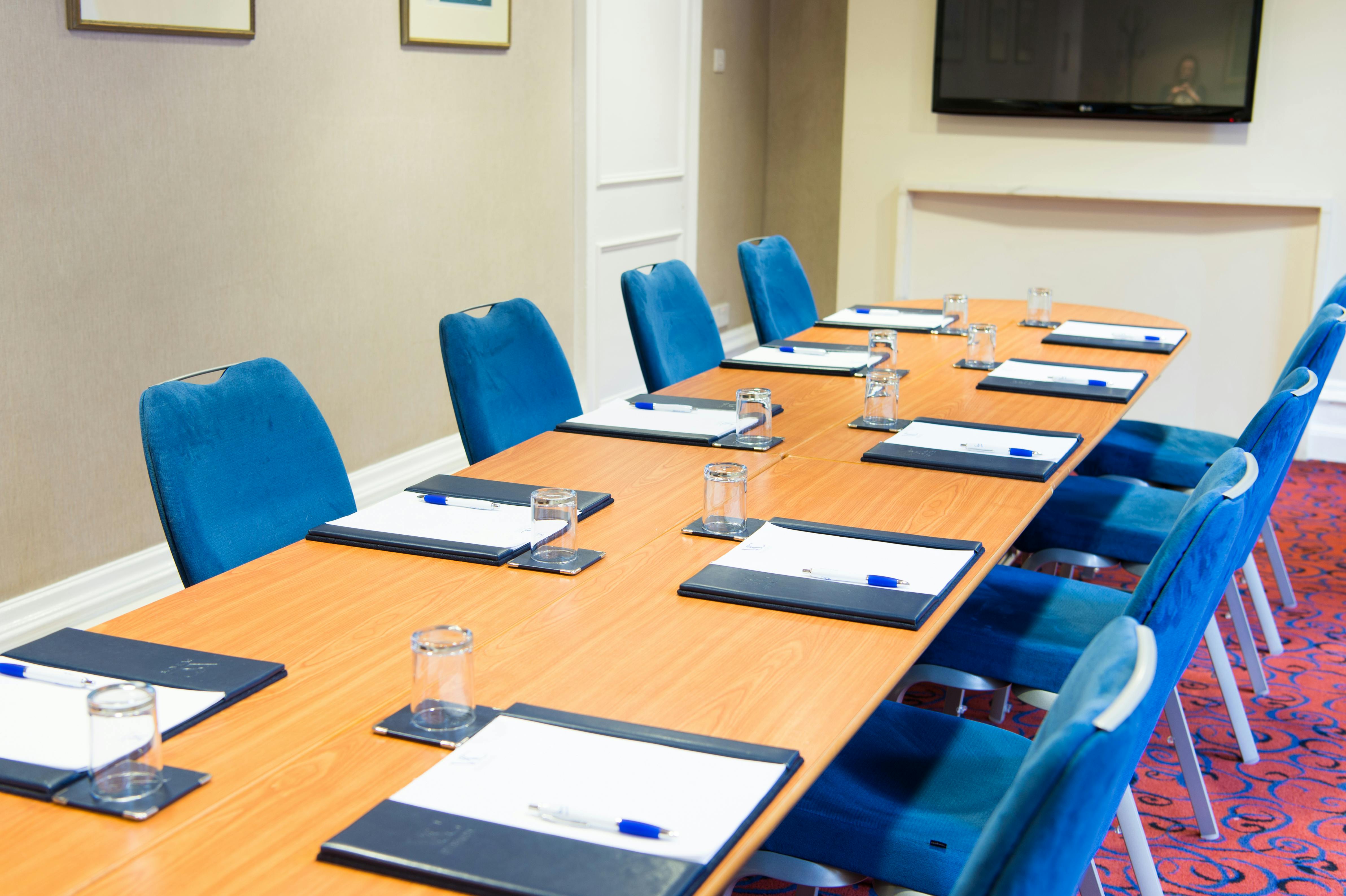 Committee Room at Victory Services Club with wooden table, ideal for meetings and workshops.