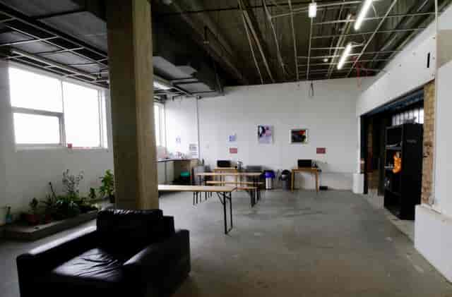 Atrium in Many Hands: versatile event space with natural light for meetings and workshops.