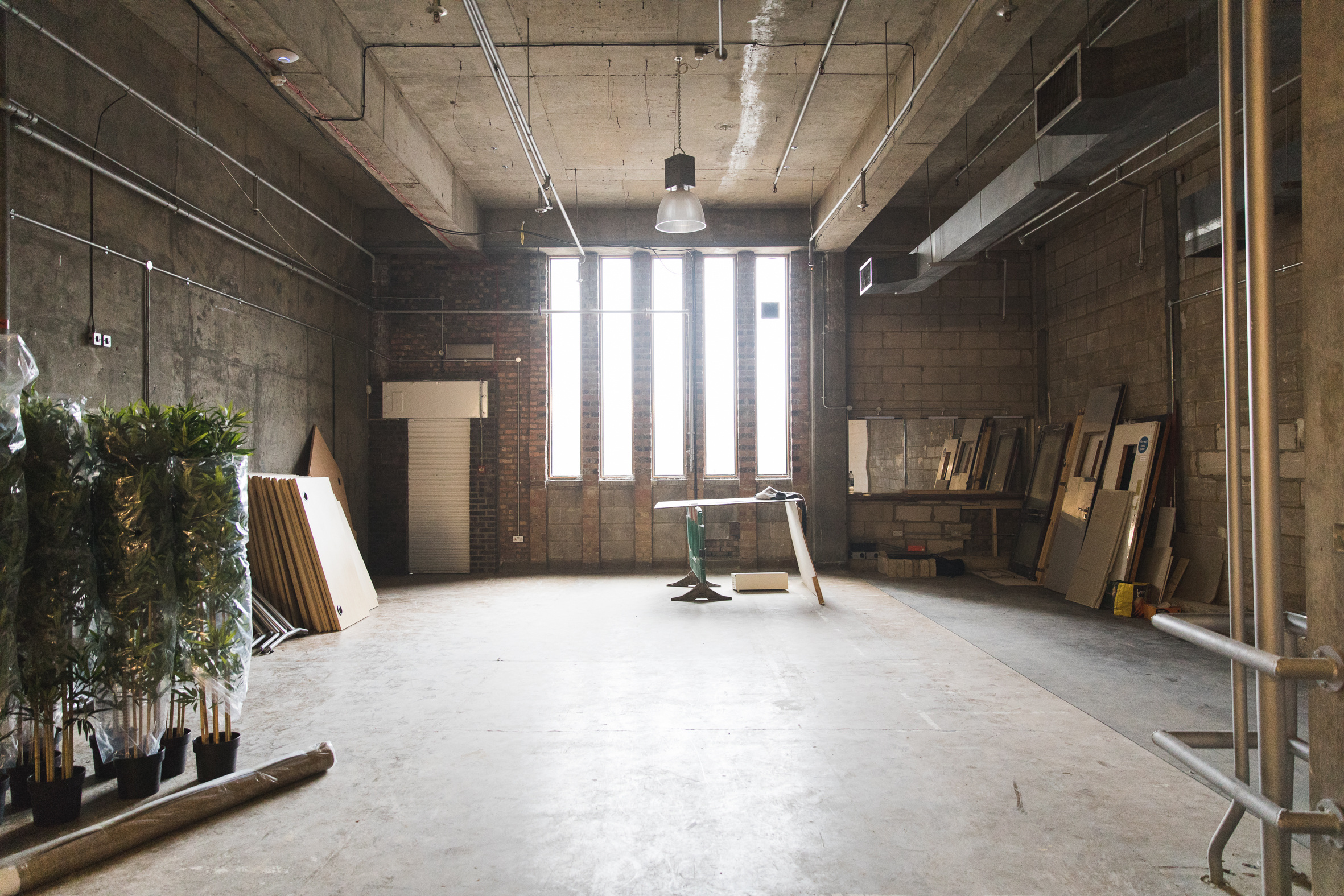 Raw industrial event venue Atrium in Many Hands, perfect for workshops and networking.