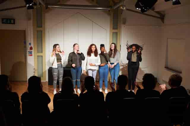 Dynamic performers engaging an audience in The Top Room, Oxford Playhouse for events.