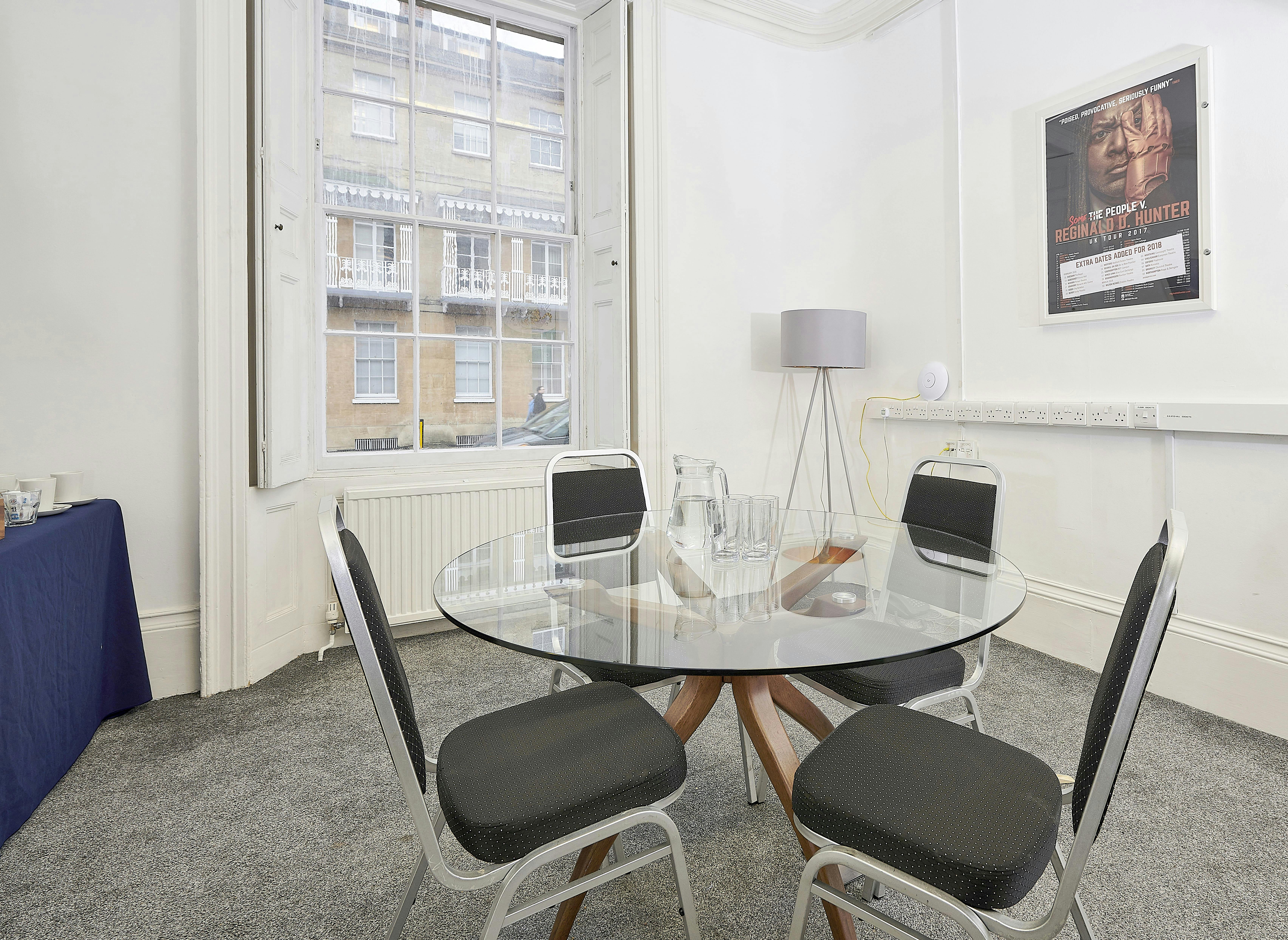 Modern meeting room at Oxford Playhouse with glass table, ideal for corporate events.