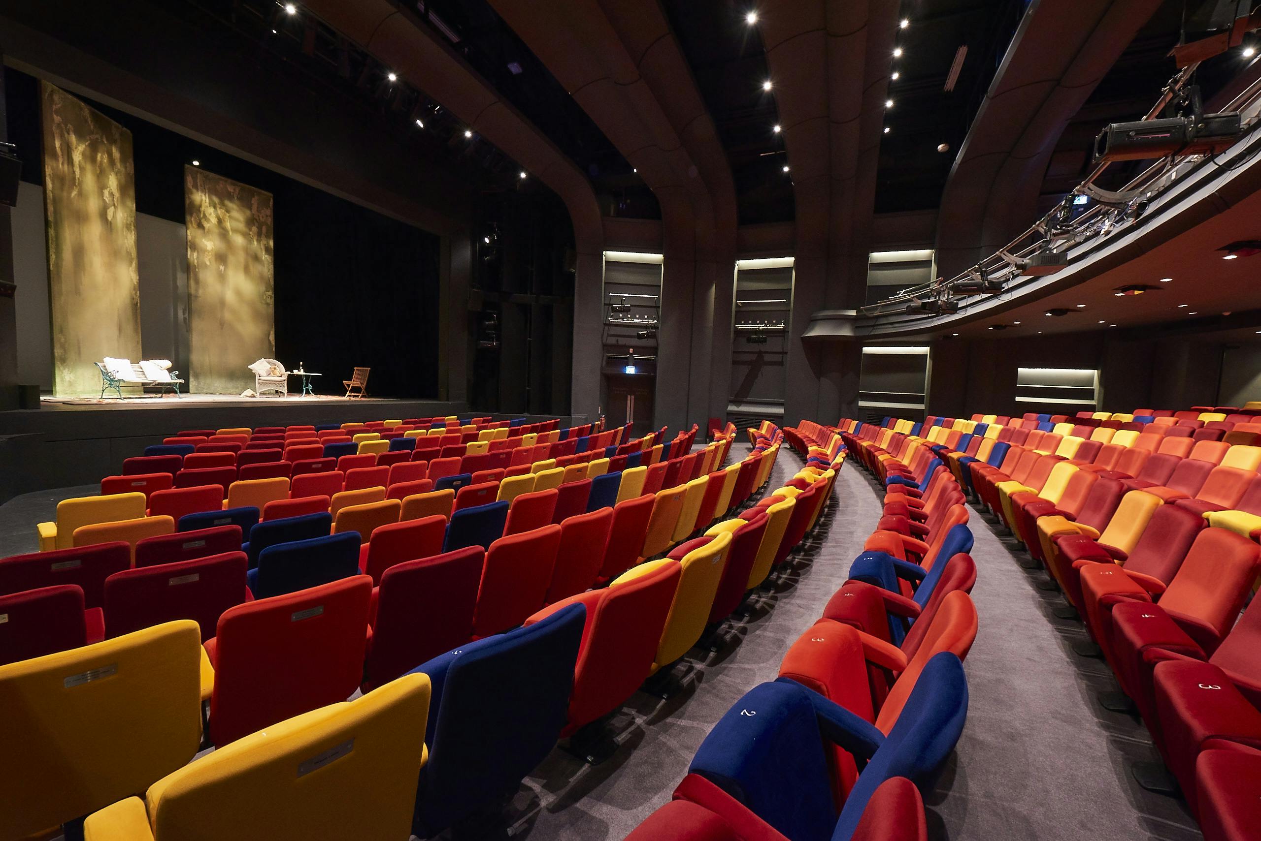 Main Stage Auditorium at Oxford Playhouse with vibrant tiered seating for events.