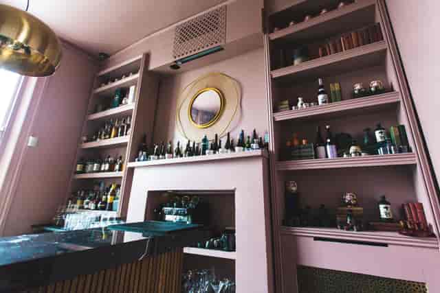 Stylish Whisky and Sake Bar with pink walls, perfect for cocktail receptions and networking.