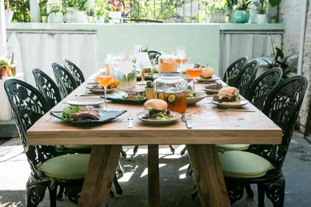 Al Fresco BBQ Garden dining setup with gourmet dishes for corporate retreats and gatherings.