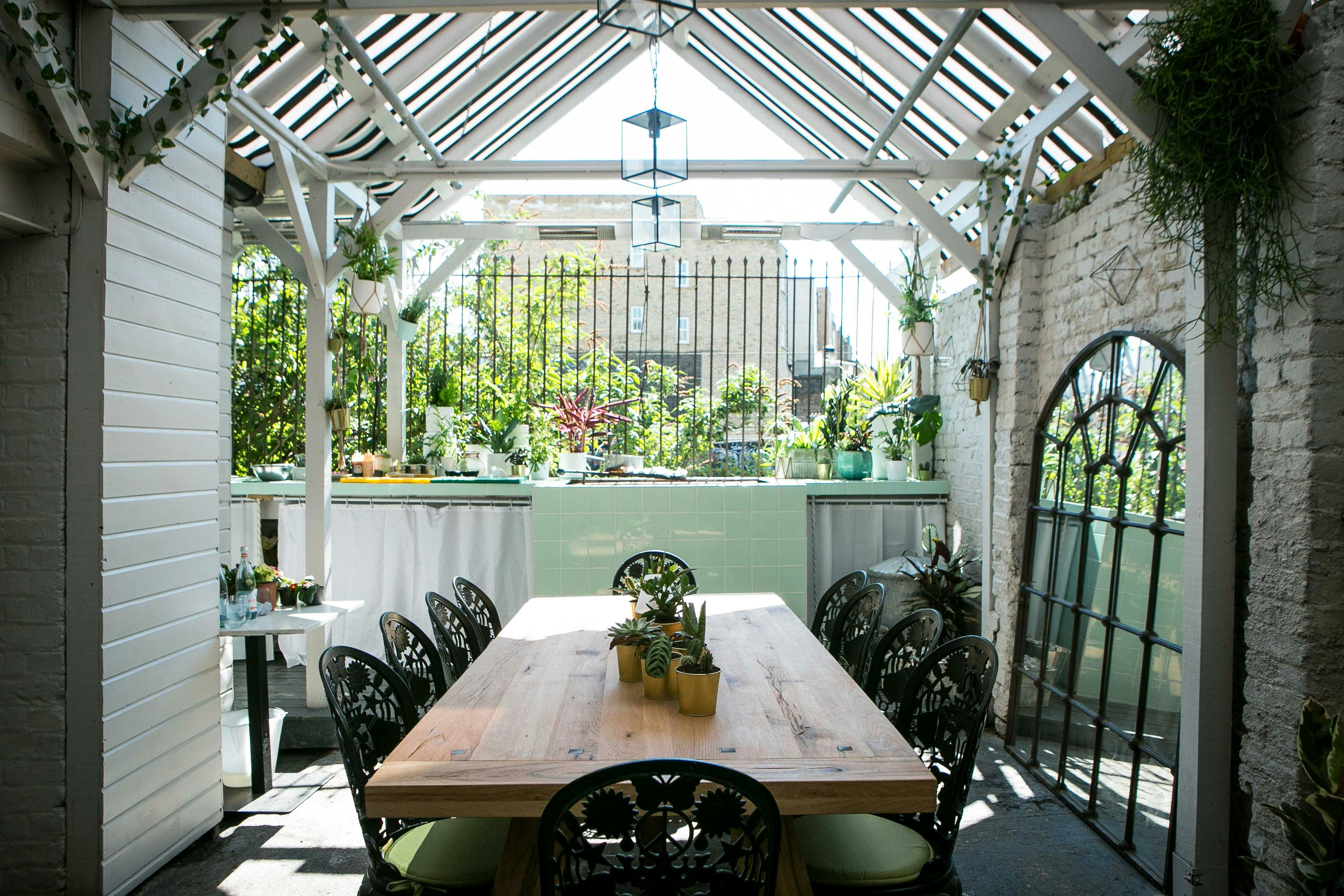 Al Fresco BBQ Garden with wooden table, ideal for meetings and events in Southam Street.