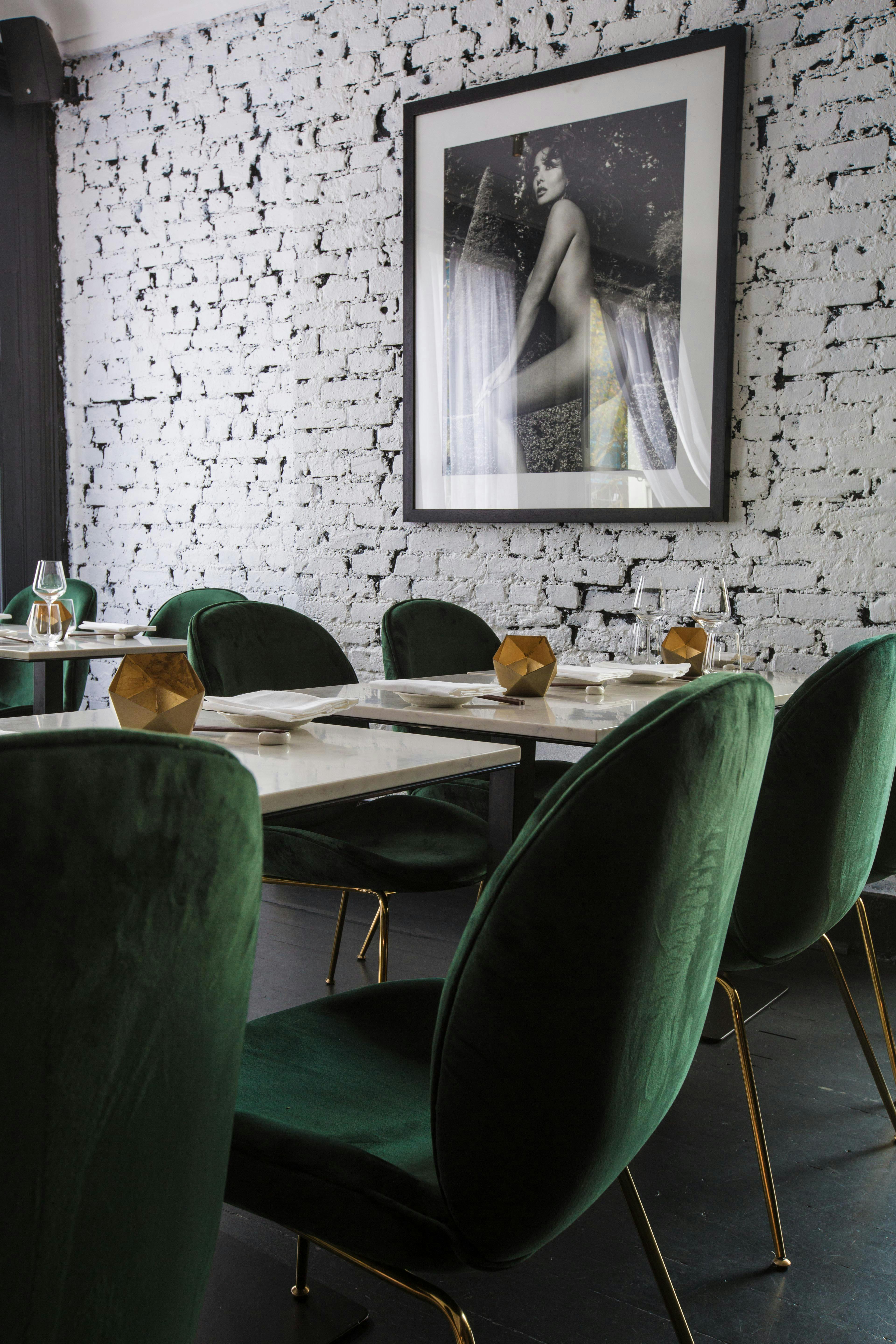 Stylish dining setup with green chairs at Robata Grill, perfect for events in Southam Street.