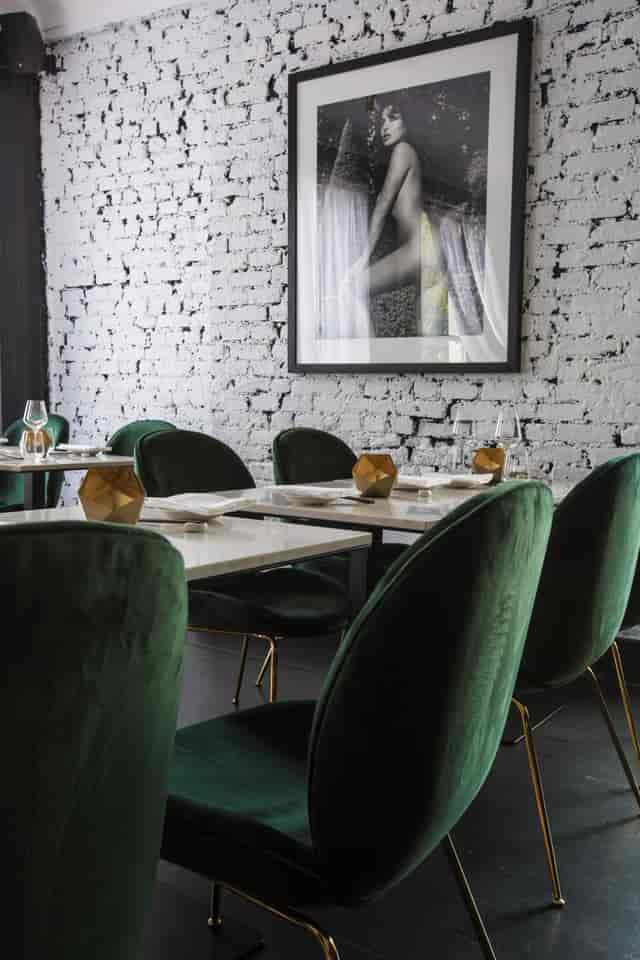 Stylish dining setup with green chairs at Robata Grill, perfect for events in Southam Street.