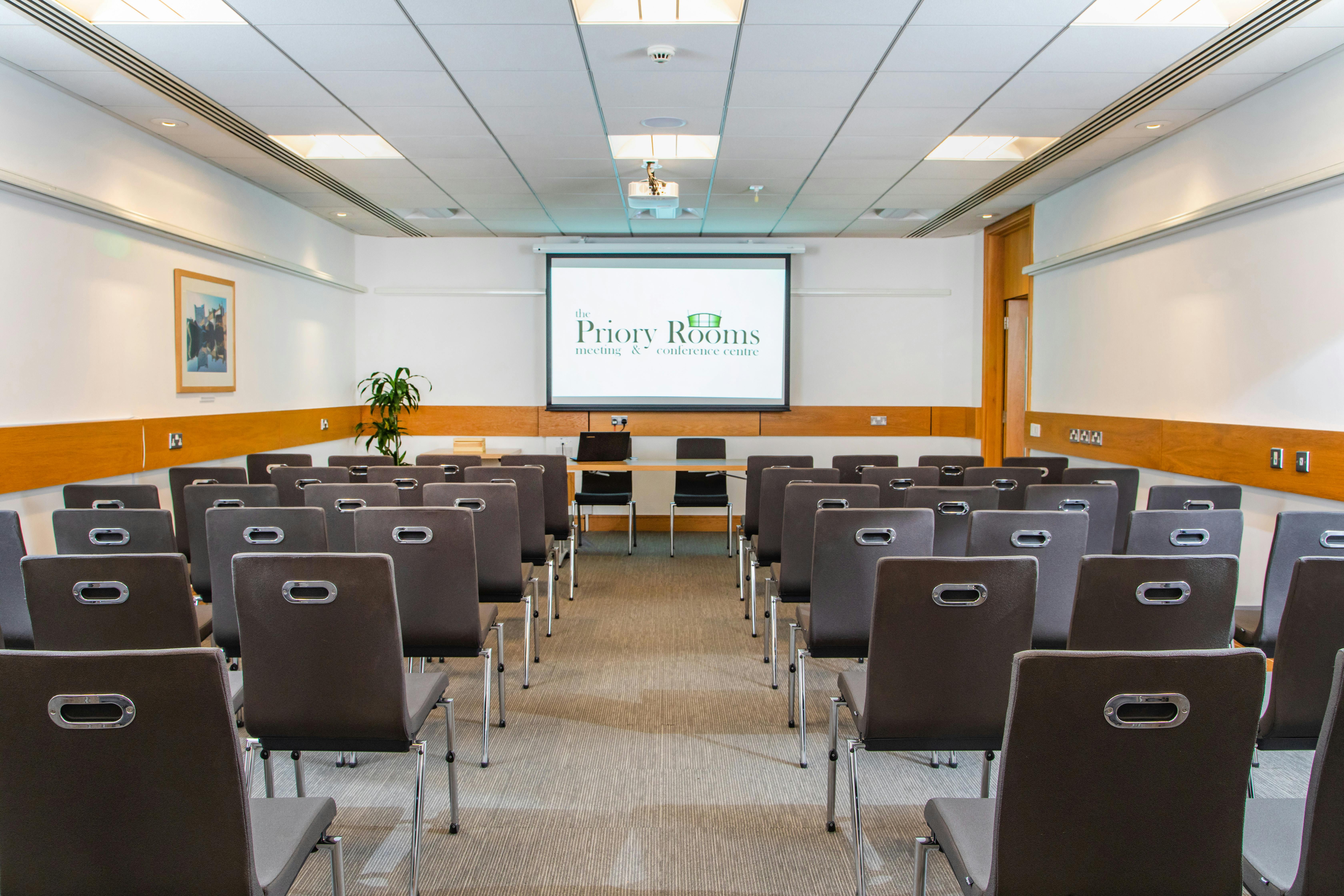 George Fox presentation setup in a modern meeting room at The Priory Rooms.