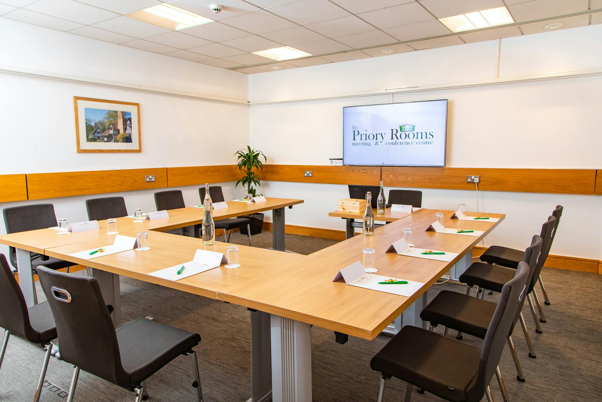 Margaret Fell in a modern meeting room with a large table for professional events.